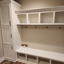 White mudroom lockers and bench